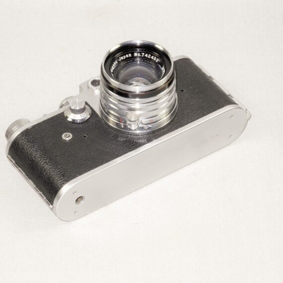 Melcon silver chrome camera Sold With: 5cm f2 Nikkor-H-C "Nippon-Kogaku" Lens & with original case Ex+/++