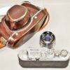 Melcon silver chrome camera Sold With: 5cm f2 Nikkor-H-C "Nippon-Kogaku" Lens & with original case Ex+/++