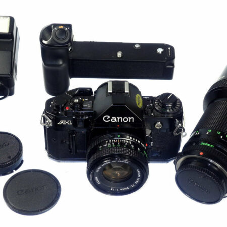 Canon A1 Black camera set with 2 lenses,  canon winder & speedlight Ex++/Mint-