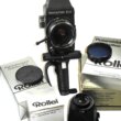 Rollei SLX camera w.80mm lens,prism finder,2 grips,Pol back Mint-