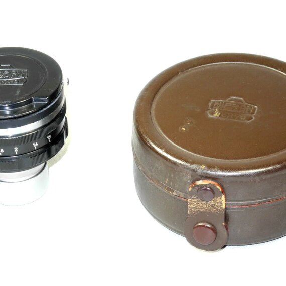 Nikon 5cm f1,1 Nikkor N.C with hood in  case with caps Ex++/Mint- RARE /SOLD