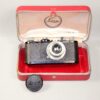 Leica Standard (E) black camera  (1937-38) with Leica 50/3,5 Nickel Elmar in Leica NY camera red case. Ex+/Ex++  Nice set / SOLD
