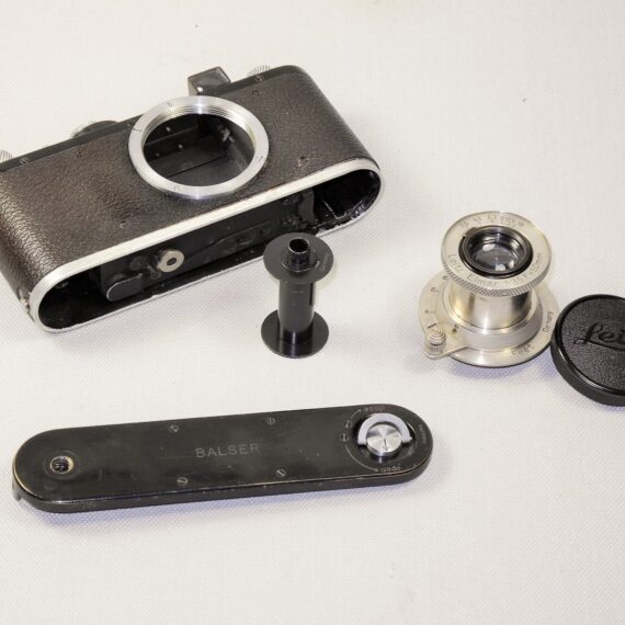 Leica Standard (E) black camera  (1937-38) with Leica 50/3,5 Nickel Elmar in Leica NY camera red case. Ex+/Ex++  Nice set / SOLD