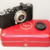 Leica Standard (E) black camera  (1937-38) with Leica 50/3,5 Nickel Elmar in Leica NY camera red case. Ex+/Ex++  Nice set / SOLD