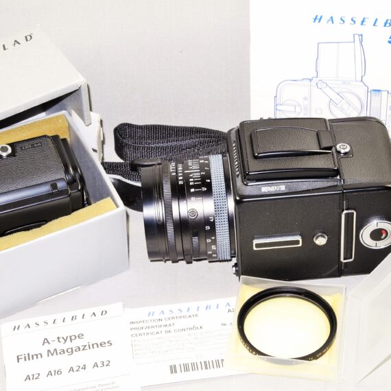 Hasselblad 501C black camera set W/80mm lens+UV filter, A12 & A24 film backs, Strap, cap & system case Mint/-SOLD