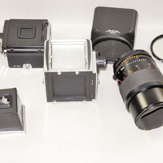 Hasselblad 500cm chrome camera W/Hasselblad 120/4 Makro-Planar CF T* lens, A12 mag, filter, hood, caps Mint- / SOLD