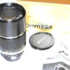 Nikon 180mm f/2.8  Nikkor*ED AIS  (E72) with built in hood, caps,box,manual Mint-