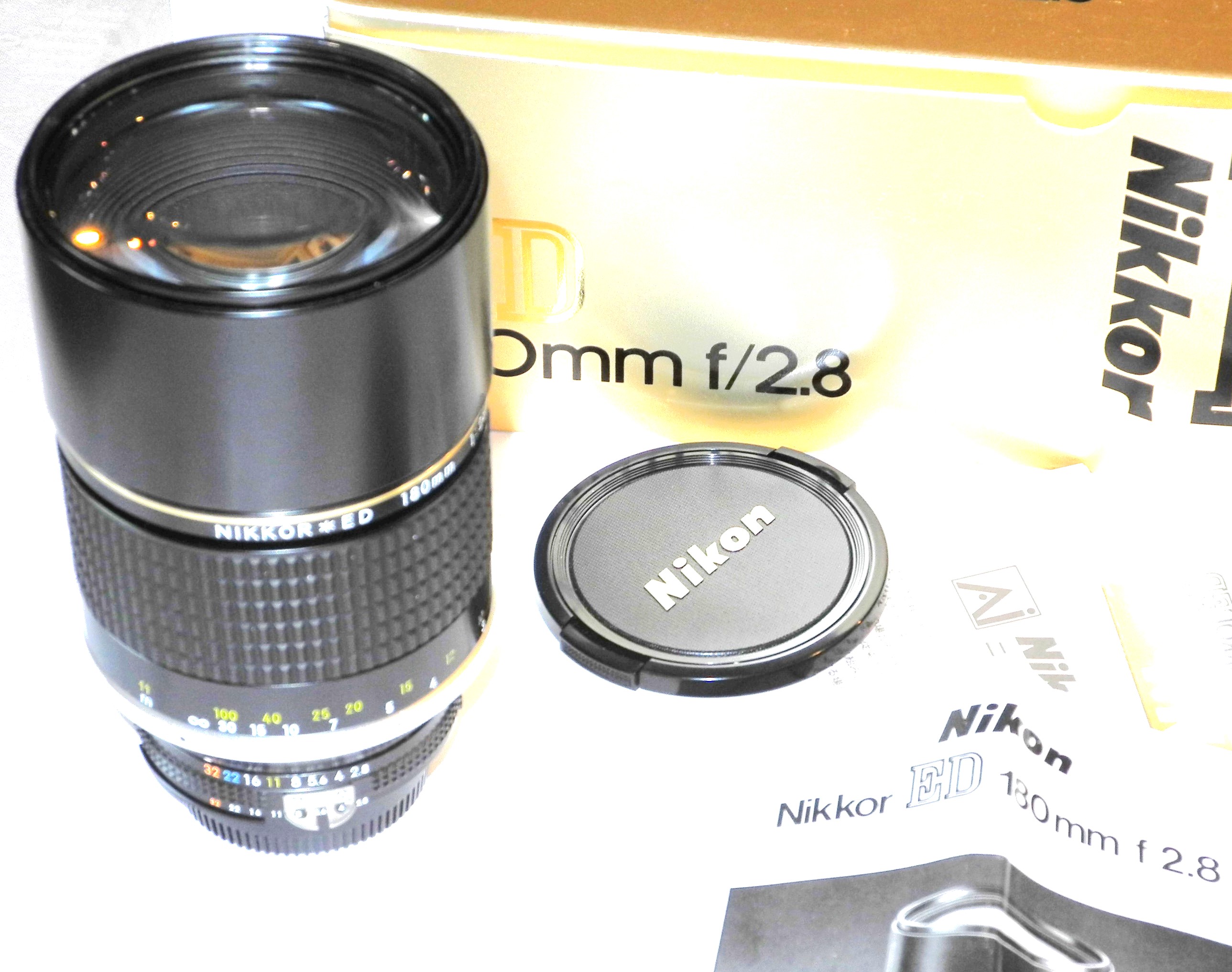 Nikon 180mm f/2.8 Nikkor*ED AIS (E72) with built in hood, caps,box