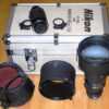 Nikon 300mm f/2,8 Nikkor ED AIS with hood,caps,extra filter holder & Nikon TC-301Teleconverter inside metal trunk Mint- lens