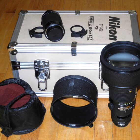 Nikon 300mm f/2,8 Nikkor ED AIS with hood,caps,extra filter holder & Nikon TC-301Teleconverter inside metal trunk Mint- lens