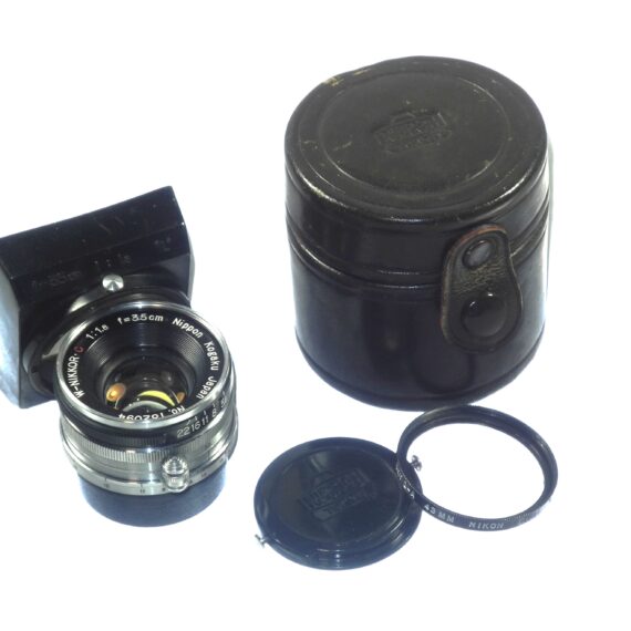 Nikon 3,5cm f1,8 W-Nikkor-C Screw mount "Nippon-Kogaku" rare lens with very uncommon-rare original Nikon lens hood, caps and leather case Mint- / Call or email for more info