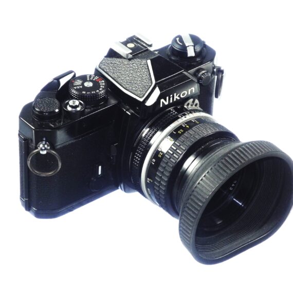 Nikon FM black 35mm mechanical camera with Nikon 50mm lens and Vivitar 80–200mmzoom lens Ex++