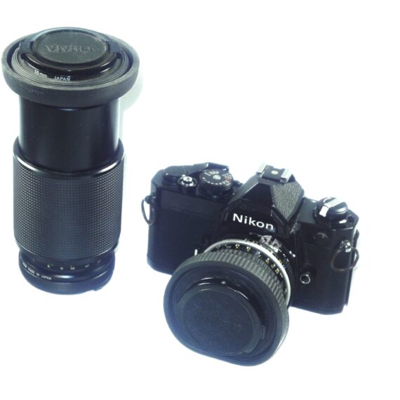 Nikon FM black 35mm mechanical camera with Nikon 50mm lens and Vivitar 80–200mmzoom lens Ex++