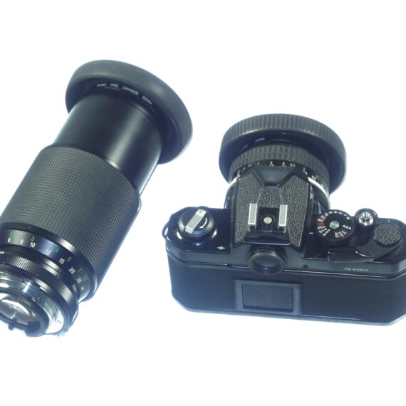 Nikon FM black 35mm mechanical camera with Nikon 50mm lens and Vivitar 80–200mmzoom lens Ex++